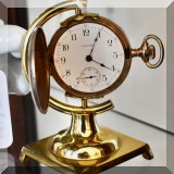 J05. Waltham pocket watch and stand. 